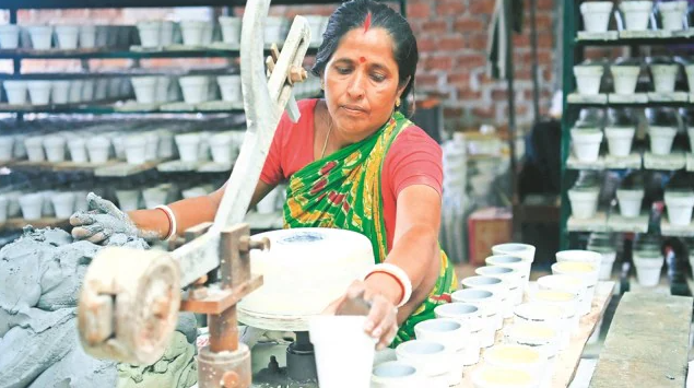 Workers are making designer mud pots in Biswakarma Terracotta and Pottery factory at Nandan Nagar on the outskirts of Agartala.