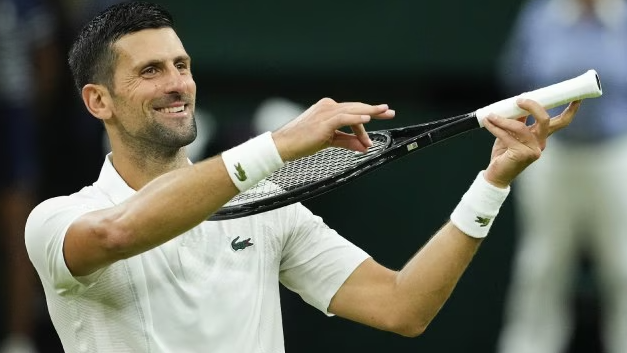 Novak Djokovic of Serbia celebrates after defeating Holger Rune of Denmark in their fourth round match at the Wimbledon tennis championships in London.