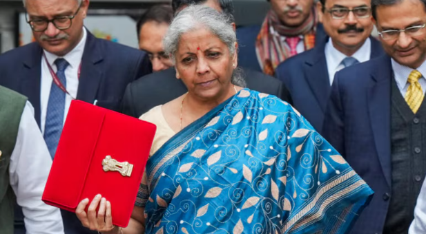 A person reviewing home loan documents, hoping for favorable tax changes in the 2025 Union Budget.