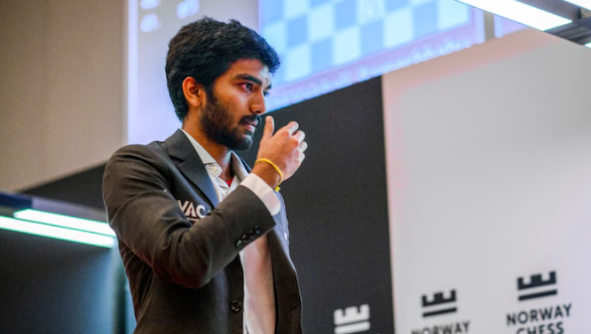 Gukesh playing chess at Grand Swiss 2025