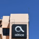 Altice International headquarters with corporate signage, representing the company’s debt restructuring and asset shift of Portugal and Caribbean subsidiaries.