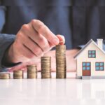 Map and buildings representing Delhi NCR showcasing a steep increase in home prices compared to Mumbai, Bengaluru, and Pune.