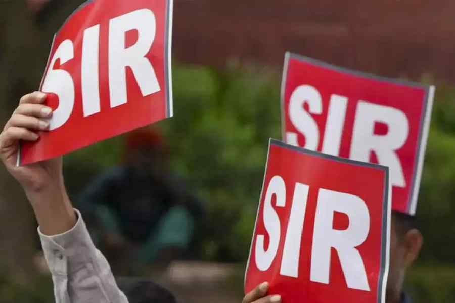 Election officials meeting BLO Antony at his home in Poonjar after he reported severe work-related stress during SIR duties.
