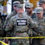 US Citizenship and Immigration Services building with American flags, representing the suspension of Afghan immigration requests following a White House shooting incident.