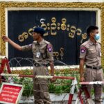 Protesters and supporters welcoming released political prisoners outside Insein Prison in Yangon, Myanmar, ahead of the December elections.