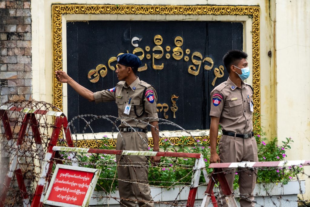 Protesters and supporters welcoming released political prisoners outside Insein Prison in Yangon, Myanmar, ahead of the December elections.