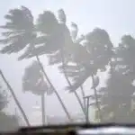 Weather map showing a developing cyclonic system near the Malacca Strait, indicating potential storm formation and rain forecast for Kerala.