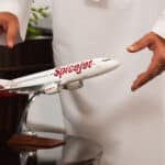 SpiceJet aircraft parked at airport with company logo visible.