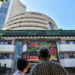 Stock market screen showing Sensex falling over 400 points and Nifty staying above 26,000 amid market volatility.