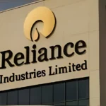 Reliance Industries stock chart rising to a new 52-week high with market data displayed on a digital trading screen