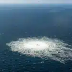 A Ukrainian man, reportedly former military officer Serhiy Kuznetsov, is escorted by Italian authorities after a court ruling approving his extradition to Germany in the Nord Stream pipeline sabotage case.