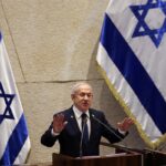 Israeli Prime Minister Benjamin Netanyahu addressing the public, amid his request for a presidential pardon in an ongoing corruption trial involving bribery, fraud, and breach of trust.