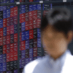 Global stock market overview showing Tokyo Nikkei decline, mixed Asian indices, rising oil prices, and falling US futures.