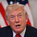 US President Donald Trump gesturing during a public statement, amid calls to close Venezuelan airspace, as tensions rise between the US and Venezuela over sovereignty and military activity.