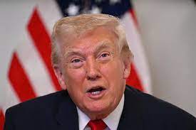 US President Donald Trump gesturing during a public statement, amid calls to close Venezuelan airspace, as tensions rise between the US and Venezuela over sovereignty and military activity.