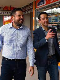 Queensland Parliament building with text overlay reading “Breach Bail, Go to Jail?” highlighting the government’s consideration of harsher youth bail laws after the Hinchinbrook by-election.