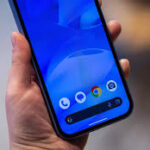 Smartphone displaying Sanchar Saathi app with a lock icon, representing the government’s directive to pre-install the app on all new phones.