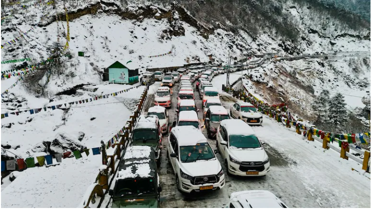 Indian Army rescue personnel helping tourists stranded in heavy snowfall in Sikkim’s Tsangu region.