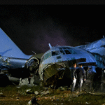 Bolivia military plane crash site with scattered banknotes and emergency response teams