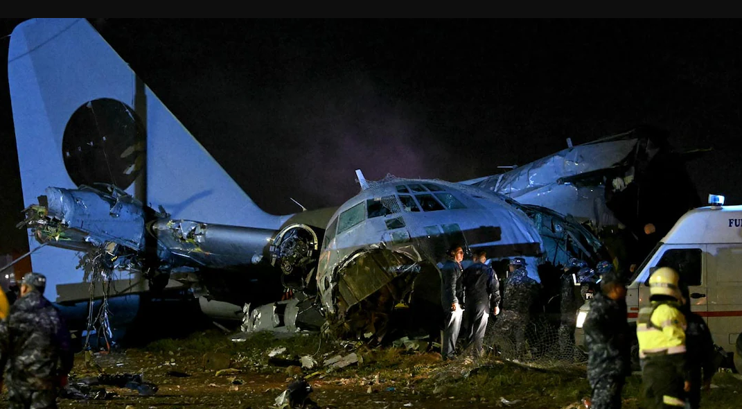 Bolivia military plane crash site with scattered banknotes and emergency response teams