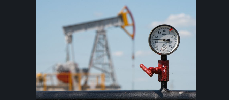 Oil pump jacks operating in a crude oil field as global oil prices surge amid geopolitical tensions