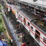 Wreckage after deadly train crash near Jakarta Indonesia with rescue teams working on site